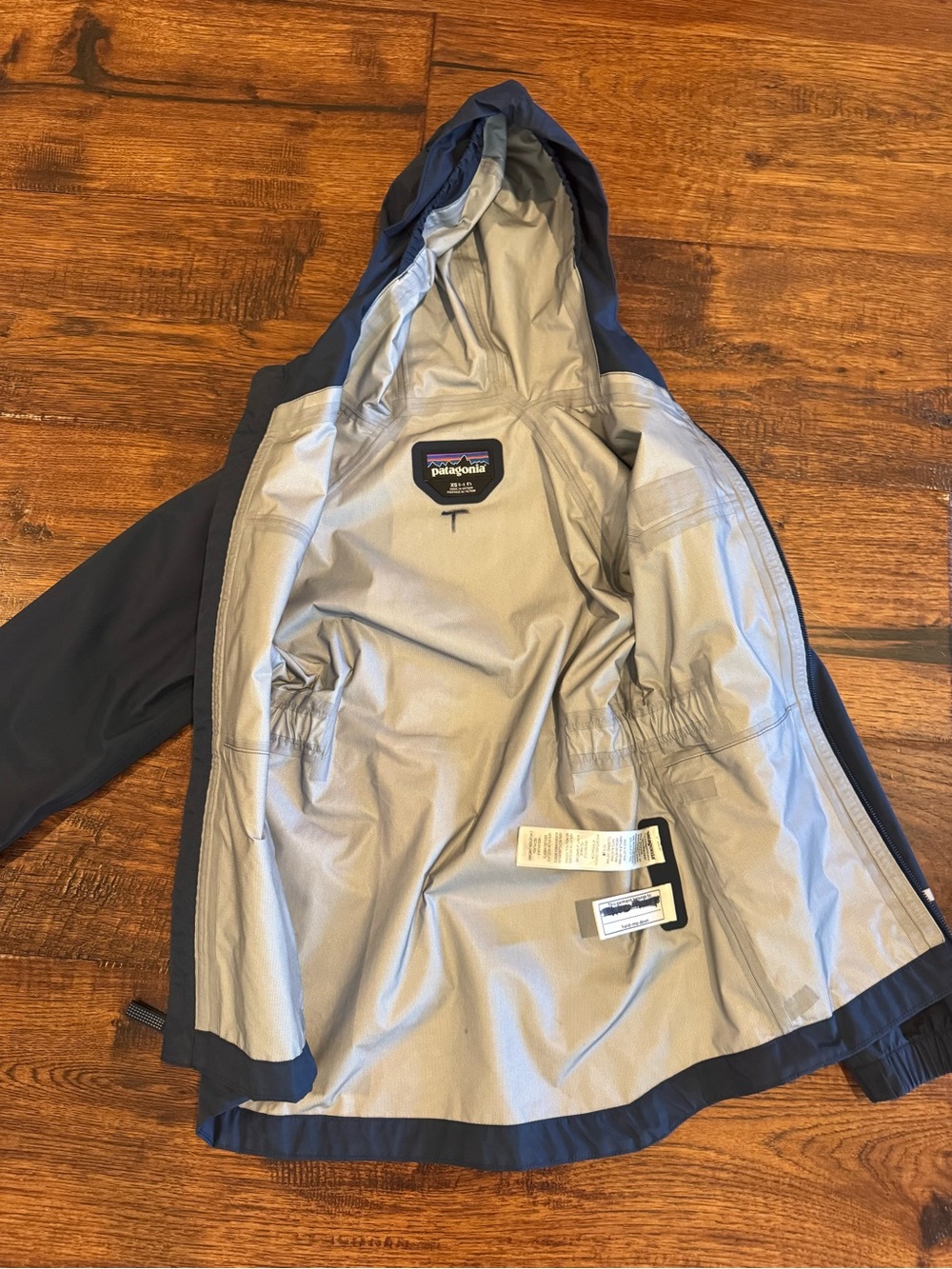 Patagonia Kids Navy Blue Hooded Rain Jacket with Reflective Trim - Picture 2 of 4